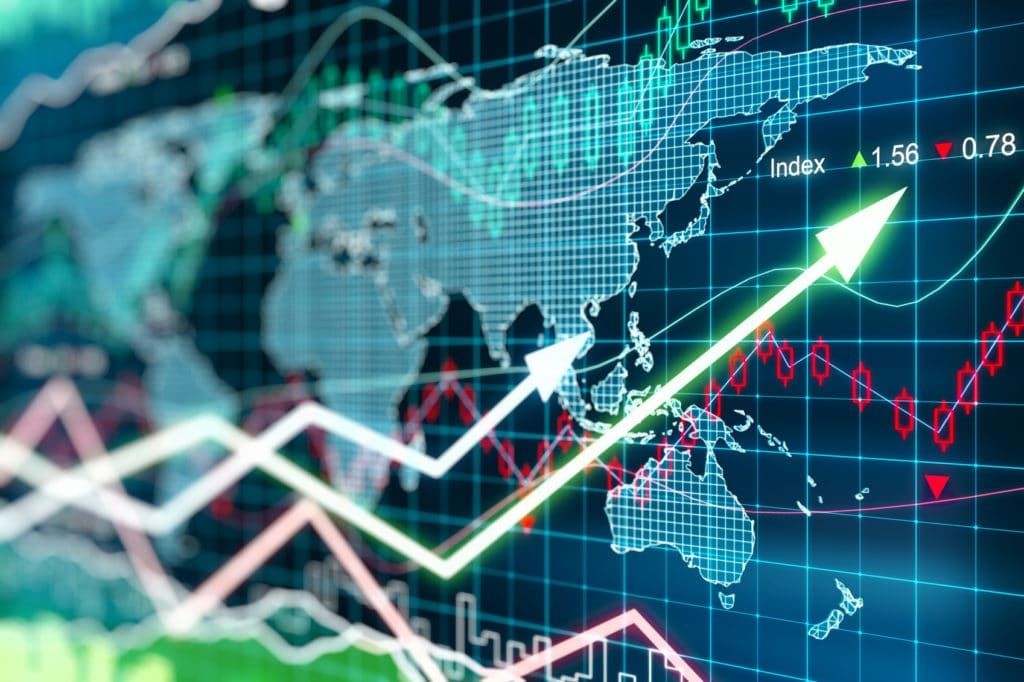 Graphical representation of global financial markets with rising and falling arrow trends over a world map backdrop.